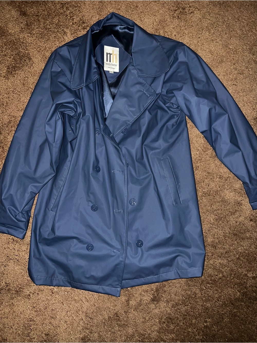 vintage Misty Harbor navy blue vinyl raincoat featuring a double-breasted button